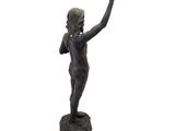 statue of a boy holding a frisbee in his right hand