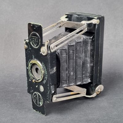 an old camera that is sitting on a table