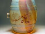 a glass cup with a dragon on it on a table