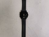 a watch that is laying on a white surface