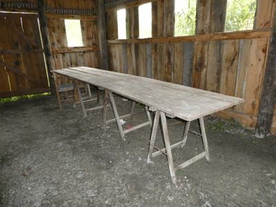 a long table that is in a room with wooden walls
