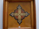 an image of a picture of a cross in a wooden frame