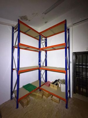 a room that has a shelf with several shelves on it