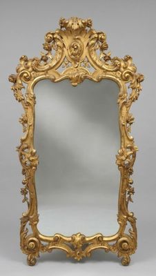 Important miroir en stuc doré à riche décor rocaille, travai…