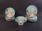 several plates and bowls are sitting on a black surface