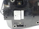 a close up of a black electrical device on a white surface
