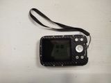 a small black camera with a strap on a white table