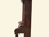 an image of a wooden chair with a clock on it