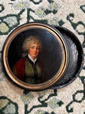 painting of a man in a green coat and a red cape