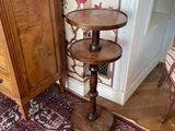 a wooden table with a shelf on it in a room
