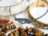 a close up of a bracelet, bracelets, and other jewelry