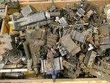 a box full of old metal parts in it