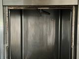 a stainless steel oven with a door open in a kitchen
