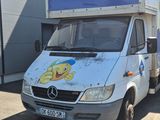 a delivery truck that is parked in front of a building