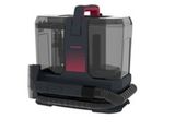 un gros plan d'un aspirateur noir et rouge sur fond blanc
