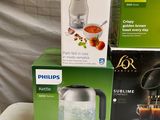 three boxes of philips electric kettles sitting on top of a table