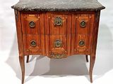a marble top chest of drawers on a stand
