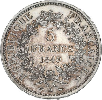 a close up of a coin with a wreath on it