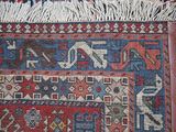 a close up of a rug with a cat on it
