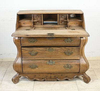a small wooden desk with a drawer on top of it