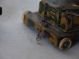 a small toy tank sitting on top of a table