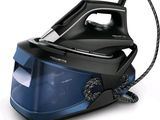 a black and blue steam iron sitting on a white surface
