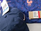a hat, shirt, and other items that are on a table