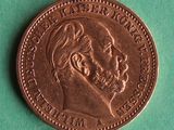 a close up of a coin with a man ' s face on it