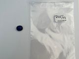 a plastic bag with a button in it on a table