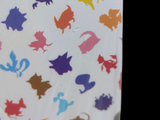 a white box with a colorful pattern of cats on it