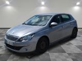 the silver car is parked on a checkered floor in a room