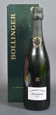 bottles of champagne and a box on a grey surface