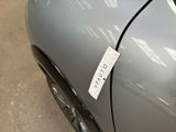 a sticker on the door of a silver car