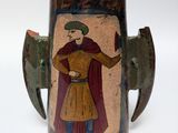 a vase with a painting of a man on it
