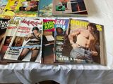 a lot of magazines on the table on the bed