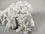 a pile of white rocks on a white surface