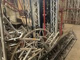 a large pile of pipes in the middle of a building
