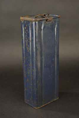 an old blue tin canister with rust on it