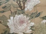 a picture of a painting of flowers on a wall