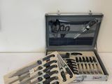 a case with a set of knives in it on a table