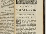 an open book with a black and white image of a page in it