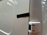 a close up of a car door with a key in it