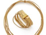 an image of a gold necklace and bracelet set on a white background