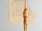 a picture of a musical instrument with a piece of paper next to it