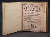 an old book opened to reveal a page with a picture of a horse