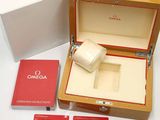 a wooden box with a watch inside of it