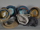 many hats that are sitting on top of a table