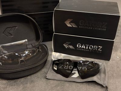 two pairs of gatorz sunglasses in a case
