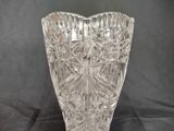 a glass vase that is sitting on a table