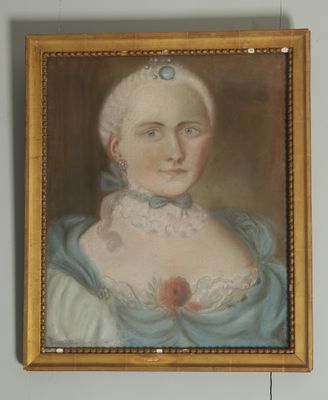 portrait of a woman in a blue dress with a flower in her hair